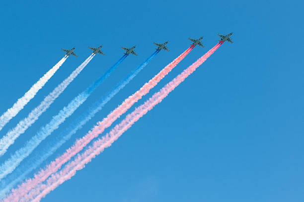 Russian air force Su-25 make a national flag by smoke stock photo