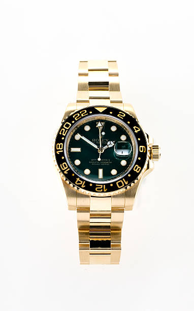 gold Rolex GMT Master 2 wristwatch stock photo