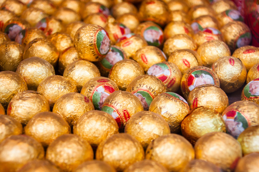 Austria, Salzburg, June 22,2012: Selective focus on a display with Mozartkugeln (Mozart Balls) It was created by the Salzburg confectioner, Paul Fürst, in 1890 and named after Wolfgang Amadeus Mozart. The Mirabell firm, based in Grödig near Salzburg, chose the name, “Real Salzburg Mozartkugeln