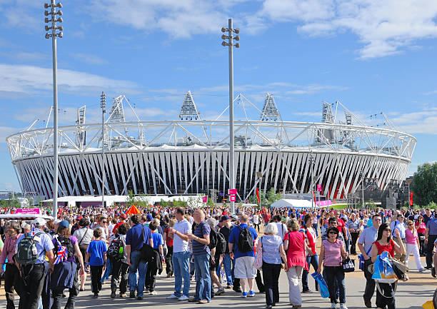 Crowds head for Olympic Stadium at London 2012 "Stratford, London, England - August 3rd, 2012: Crowds gather in anticipation of the 1st day of Athletics at the Olympic Stadium, Stratford in London, England for the London 2012 Olympic Games." 2012 stock pictures, royalty-free photos & images