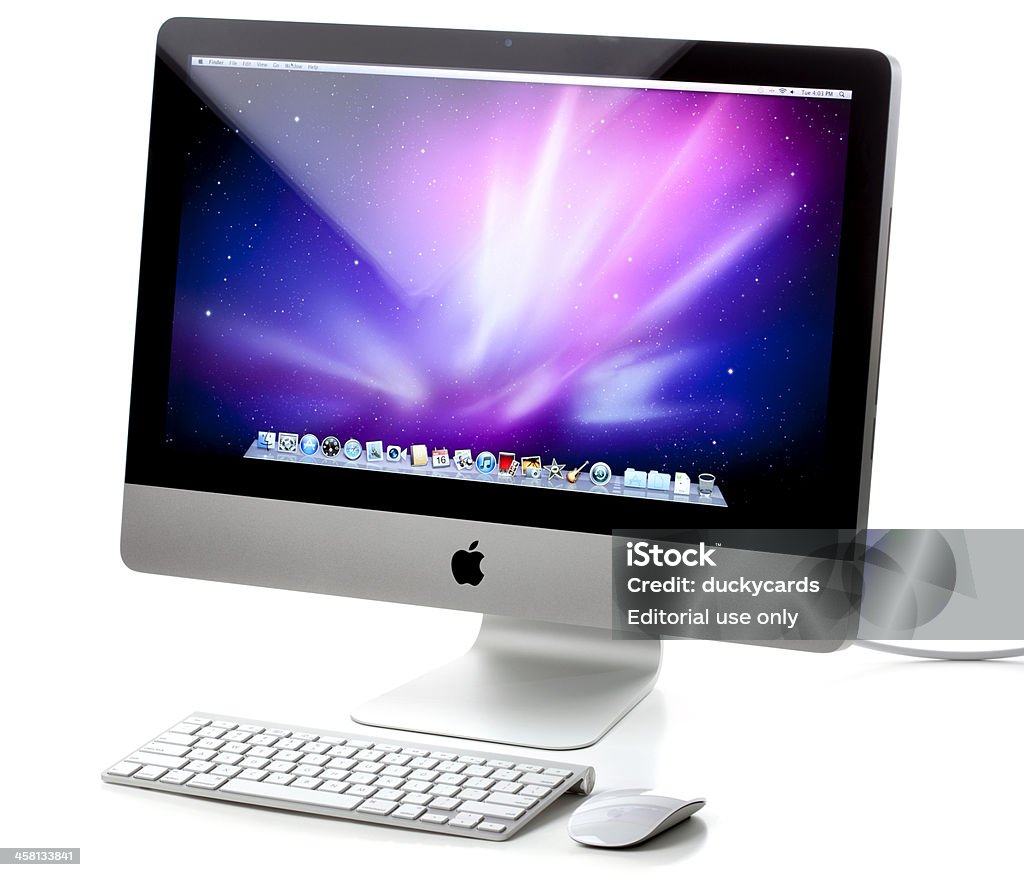 Da 21,5 pollici Computer Apple iMac con Mouse e tastiera Wireless - Foto stock royalty-free di Comunicazione