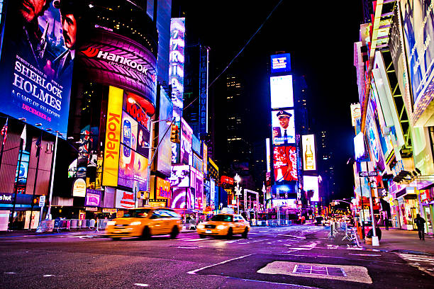 Times Square "New York, NY, United States - December 28, 2011: Times Square is a busy tourist intersection of neon art and commerce and is an iconic street of New York City and America" retail digital signage stock pictures, royalty-free photos & images