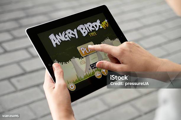 Play Angry Birds On Apple Ipad2 Stock Photo - Download Image Now - Angry Birds - Game, Playing, Portable Information Device