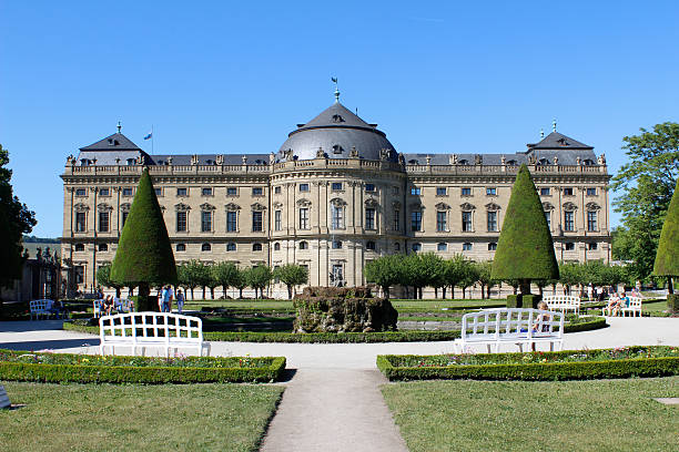 Würzburg Residence - a UNESCO World Heritage Site "WArzburg, Bavaria, Germany - May 25, 2012: People enjoy the warm sunlight in the beautiful gardens of the Residence palace in WArzburg on a spring afternoon." FL-photography stock pictures, royalty-free photos & images