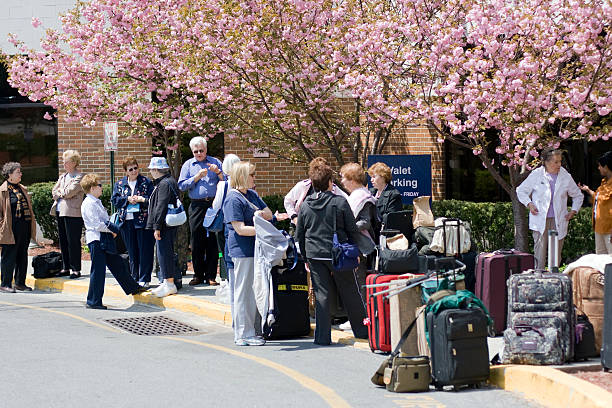 Seniors waiting for Tour Bus stock photo