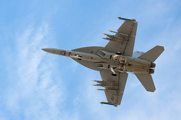 F-18 Super Hornet "Farnborough, United Kingdom - July 20, 2010: A USAF F-18 Super Hornet fighter jet on landing approach to the Farnborough International Airshow." fa 18 hornet stock pictures, royalty-free photos & images