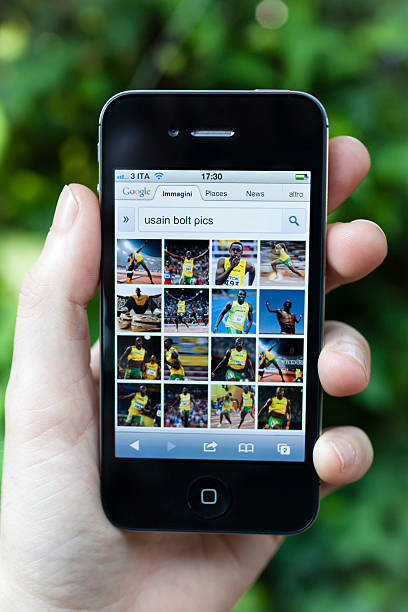 Iphone 4S Displays Usain Bolt with Google Image stock photo