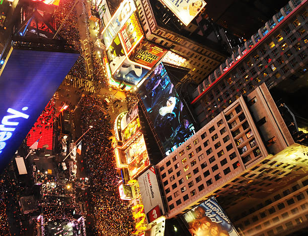 New Years Eve 2012 in Times Square, NYC "New York, USA - December 31, 2011: Crowds gather to celebrate New Years Eve in New Yorks City\'s Time Square on December 31, 2011" times square new years eve stock pictures, royalty-free photos & images