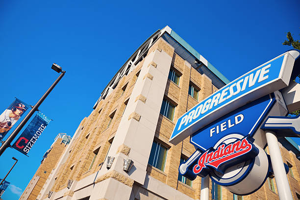 Progressive Field sign "Cleveland, Ohio, USA - August, 21 2012: Progressive Field sign in front of the stadium in the center of Cleveland. The stadium was opened in 1992 and is home to Cleveland Indians - baseball team from the Central Division of American Baseball League. The stadium currently has the capacity of 43000 people. Seen during summer afternoon." american league baseball stock pictures, royalty-free photos & images