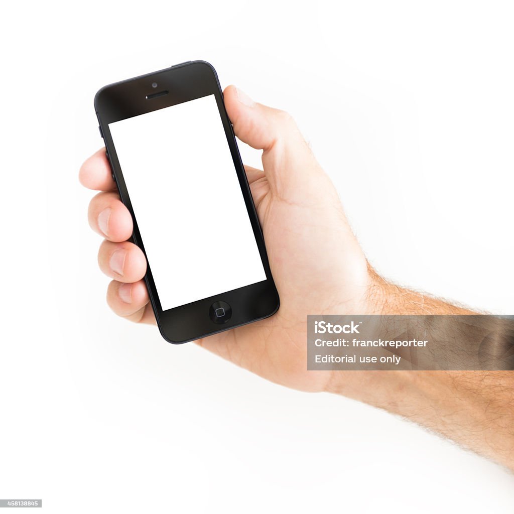Ludzką ręką trzymając nowy Apple iphone 5 - Zbiór zdjęć royalty-free (Apple Computers)