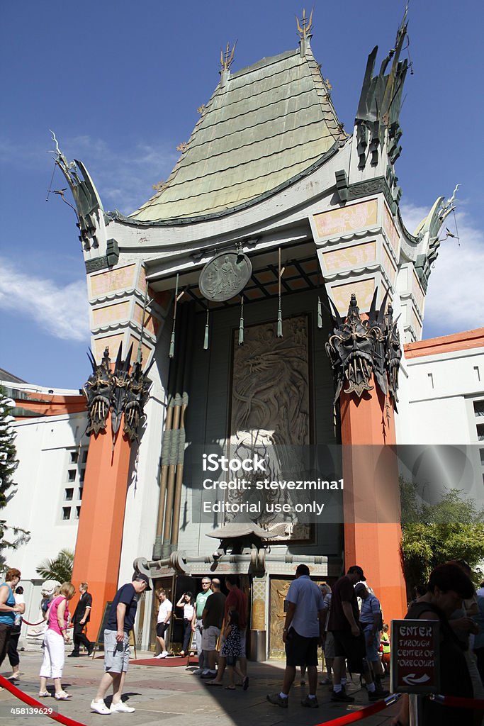 Grauman's Chinese Theater "Los Angeles, CA, USA - September 29th, 2012: People visiting Grauman's Chinese Theater in Los Angeles, California. The Chinese Theatre in Hollywood is the most famous movie theatre in the world. Millions of visitors flock here each year, most of them drawn by its legendary forecourt with its footprints of the stars. Located at 6925 Hollywood Boulevard, Hollywood, CA 90028." Arts Culture and Entertainment Stock Photo