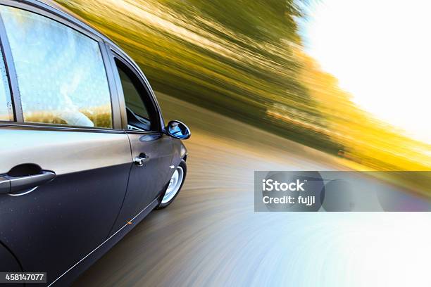 Side View Of Luxury Car Stock Photo - Download Image Now - Activity, Black Color, Blurred Motion