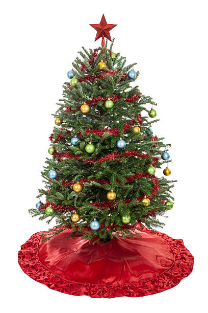 Christmas Tree Decorated Christmas tree with skirt, garland, oranaments and star isolated on white skirt stock pictures, royalty-free photos & images