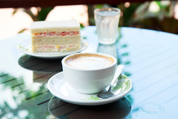 istock cup of cappuccino over wooden table 458217001