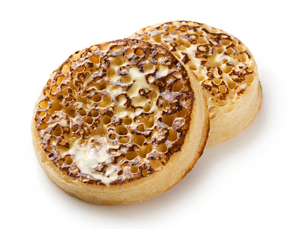 istock English crumpet with melting butter on a white background 458218271