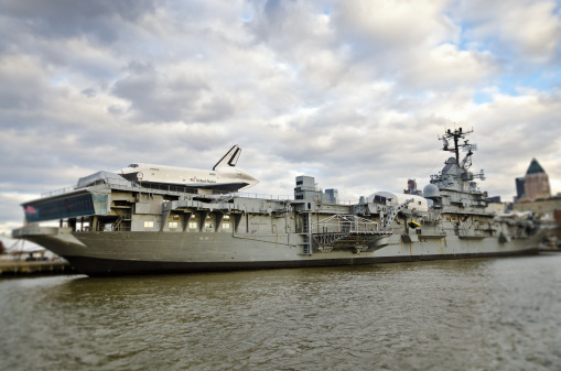 New York, USA - December 11, 2012: The Space Shuttle Enterprise is on Air & Space Museum where it was placed on display a top the World War II aircraft carrier USS Intrepid on the Hudson River in New York City. The space shuttle Enterprise named after the spaceship in Star Trek