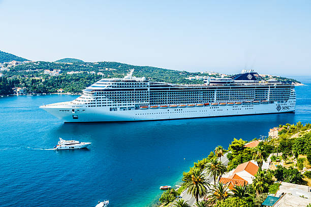 Dubrovnik, Croatia - July 26, 2013: A cruise ship MSC Divina approaching Cruise Port of Dubrovnik in Dubrovnik, Croatia on it's 7 nights East Mediterranean cruise. It is owned by MSC Cruises. It can host up to 3,959 passengers.