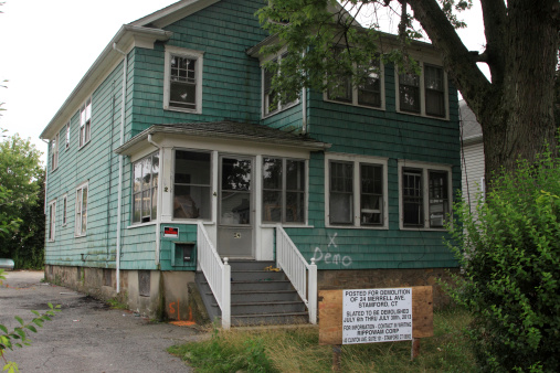 Stamford, USA - July 11, 2013: A house to be demolished on the West Side area of Stamford. Stamford was known as Rippowam by the Native Americans until July 1, 1640. Today the city is the fourth largest in the state and the eighth in New England.