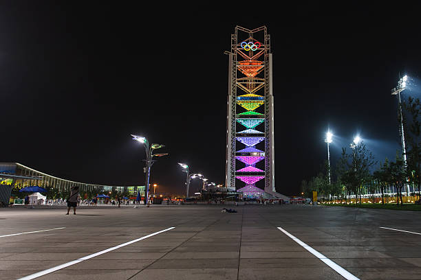Beijing, China -  August 16, 2008: Olympic tower with 5 Olympic rings glows at night during the Summer Olympics