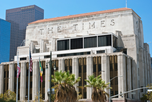 Los Angeles, California (USA). August 15, 2012. The faAade of the Los Angeles Times (newspaper) building, completed in 1935, with the more recent Wells Fargo skyscraper in the background. The Los Angeles Times building is an example of Art Moderne architecture. It was designed by Gordon B. Kaufmann and is located at 202 West 1st Street in downtown Los Angeles.