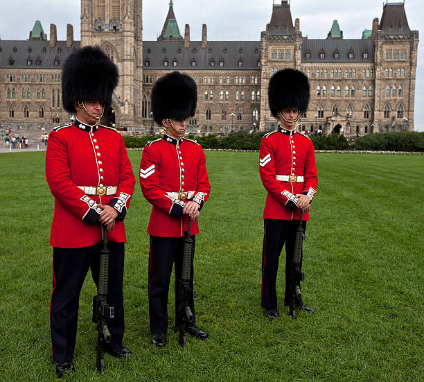 Canadian Guards Ottawa, Ontario - August 14, 2012: Canadian Guards at Parliament building in Ottawa after change of guards ceremony. trishz stock pictures, royalty-free photos & images