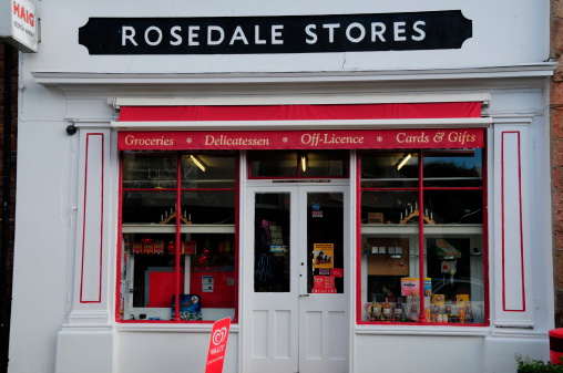 Jersey, U.K. - November 29, 2012: Rosedale stores a Gorey Village corner shop. A traditional business with old charm competing with modern large stores.