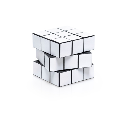Kiev, Ukraine - February 25, 2013: A white Rubik's Cube isolated on a white background. Rubik's Cube is a twist 3D puzzle game, created and designed by Erna Rubik in 1974.