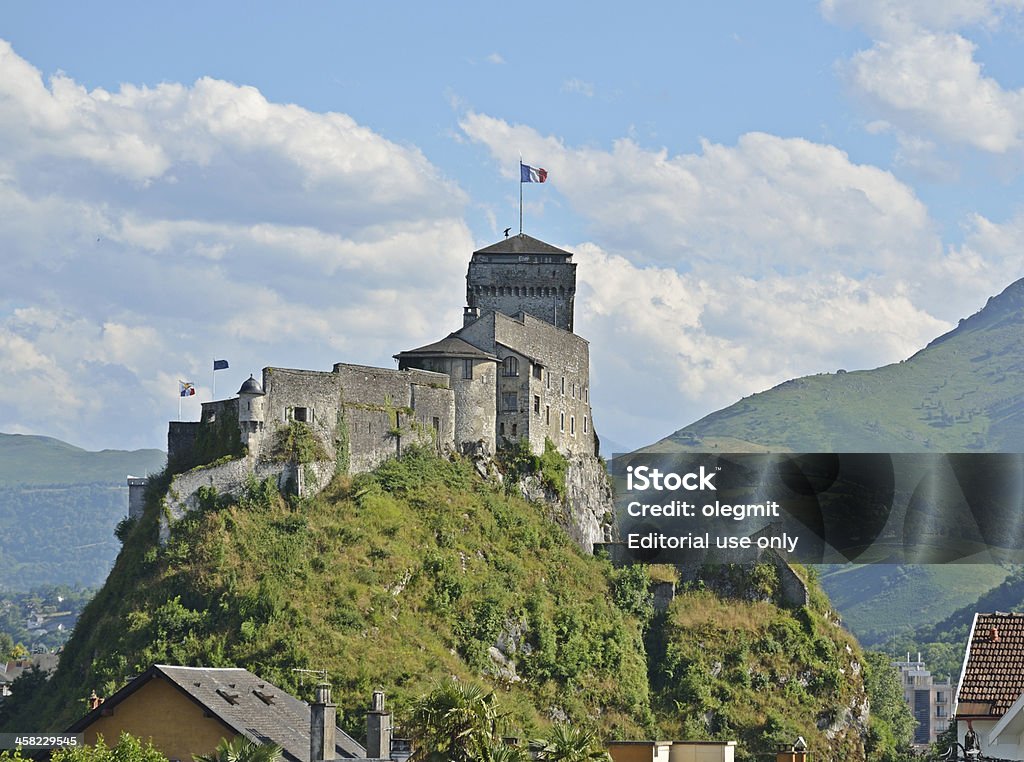 Medieval fortress of Lourdes Lourdes, France - July 07 2012: An ancient castle dominates on the green rock above the famous town Lourdes. Ancient Stock Photo