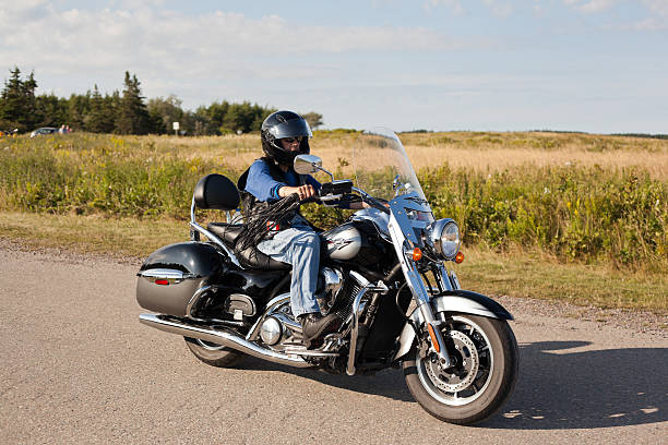 mann auf motorrad - louisbourg stock-fotos und bilder