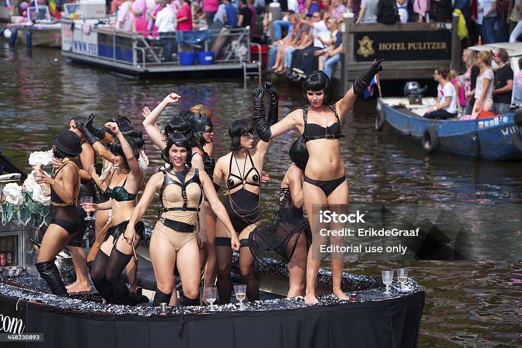 Amsterdam Canal Parade 2012 Amsterdam, The Netherlands - August 4, 2012:  Participants dance in front of spectators at the famous Canal Parade of the Amsterdam Gay Pride 2012 on August 4, 2012 in Amsterdam 2012 Stock Photo