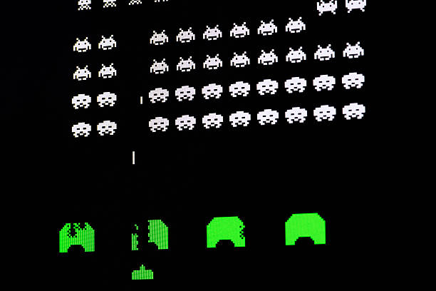 Computer image of video game Borgosesia, Italy - September 1, 2012: Close up of vintage classic videogame on computer monitor: Space Invaders space invaders game stock pictures, royalty-free photos & images