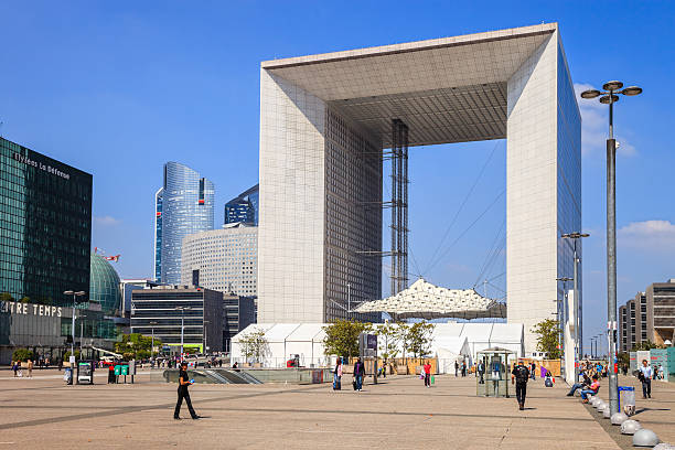 Great Arch Paris, France - May 21, 2010: Tourists walking in the central square of La Defense, in the background is The Big Arch monument. french currency photos stock pictures, royalty-free photos & images