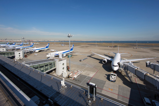 Tokyo, Japan - December 5, 2012: A chunk of All Nippon Airways passenger airplanes at Tokyo International Airport (Haneda Airport) Terminal 2 in Japan. All Nippon Airways is one of the largest airlines in Japan.