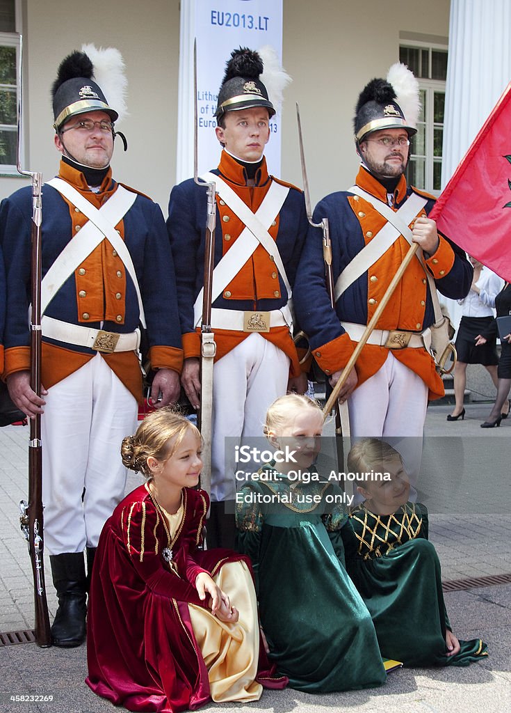 State Day of Lithuania, Vilnius Vilnius, Lithuania - July 6, 2013: Costumed participants at ceremony in honour of State Day of Lithuania (Coronation of King Mindaugas)  on the square of the Presidential Palace  at 6 July 2013 in Vilnius, Lithuania. Adult Stock Photo