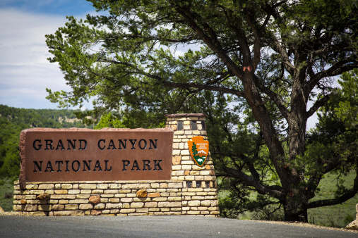 Grand Canyon National Park, Arizona, USA - August 12, 2012:  The sign of the Grand Canyon National Park located at the east park entry on the South Rim