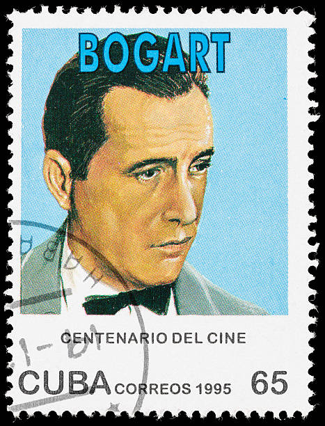 Cuba Humphrey Bogart postage stamp Sacramento, California, USA - October 14, 2012: A 1995 Cuba postage stamp with an illustration of actor Humphrey Bogart, as part of the worldwide celebration of a "Century of Cinema". Bogart (1899-1957) won an Academy award for best actor for his role in 'The African Queen' in 1951. humphrey bogart stock pictures, royalty-free photos & images