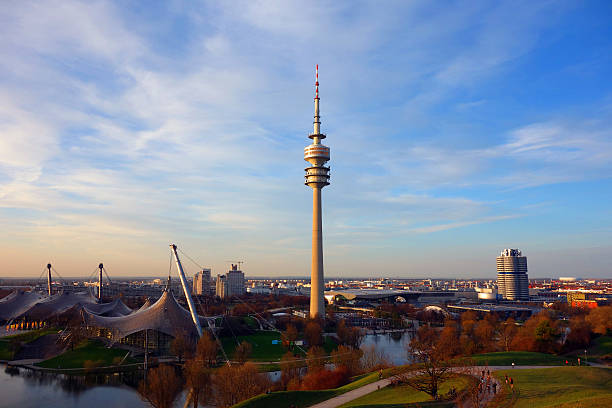 Munich, Germany - April 15, 2013: Munich's Olympic Tower and BMW Centre (Germany); you can also see Munich Olympic Stadium and Park as well as the famous Allianz Arena at the horizon .