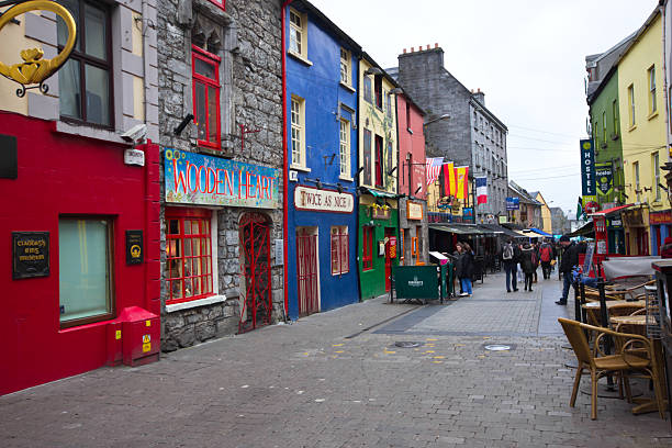 Galway Ireland Galway, Ireland - March 31, 2013: Street scene in historic Galway City Ireland on Mar 31, 2013.  This medieval coastal city is now a lively cultural center and popular tourist destination. county galway stock pictures, royalty-free photos & images