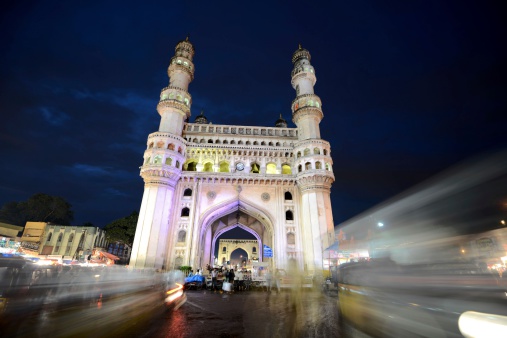 Hyderabad, India – August 11, 2012: During the holy month of Ramadan, Muslims gather after sunset to eat, drink and shop in the busy bazaar around the Charminar in the hart of the old city.