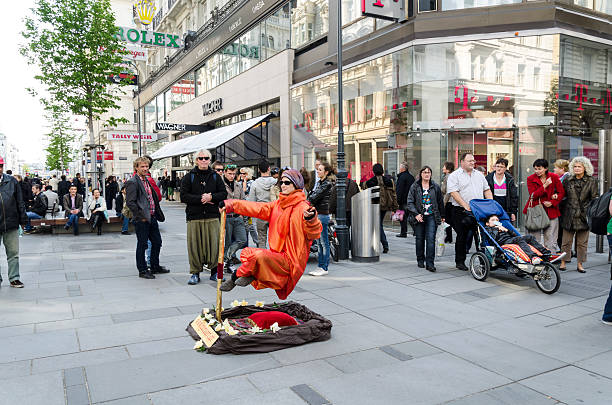 Vienna, Austria - April 20th, 2012: Woman in orange floating \