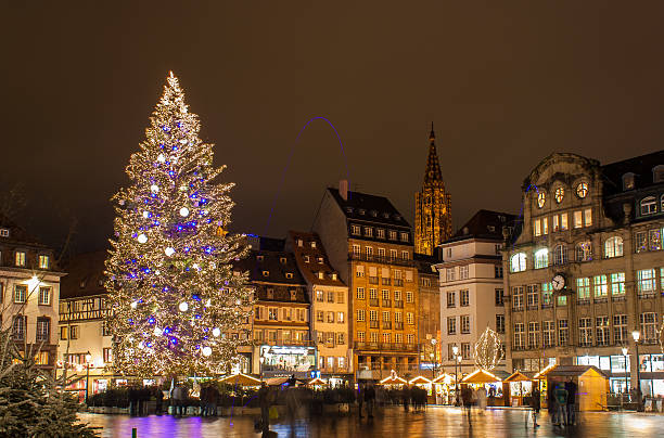 Christmas tree at Place Kleber in Strasbourg France, Strasbourg - December 4, 2012: A Christmas Tree at Place Kleber in Strasbourg. Strasbourg is named as "Capital of Christmas" notre dame de strasbourg stock pictures, royalty-free photos & images