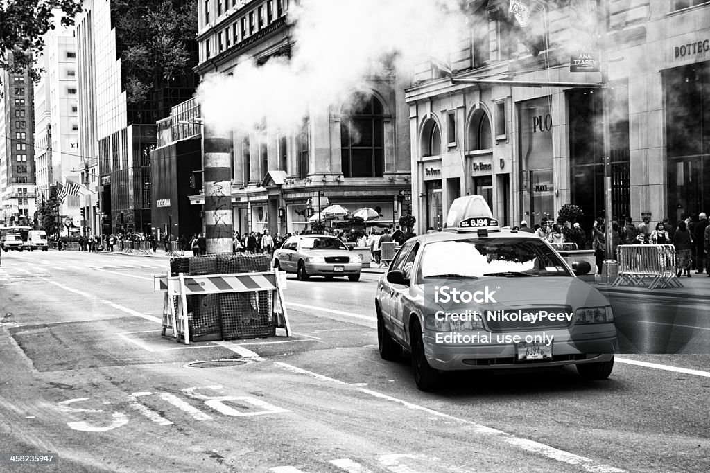 New York Taxi and Steam Stack New York City, USA - October 8, 2012: New York Taxi and Steam Stack at 5th Avenue in Manhattan, New York. American Culture Stock Photo