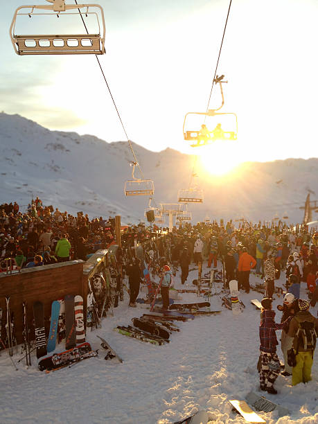 Val Thorens, France - January 3, 2012: Skiers and Snowboarders party outside La Folie Douce bar at sunset in the ski resort of Val Thorens, France on 3rd January 2012.