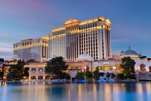 Las Vegas, Nevada, USA - January 7, 2013: Luxurious hotel Caesars Palace at twilight, located at the Paradise area in the Las Vegas Strip, as seen over the Bellagio Lake.