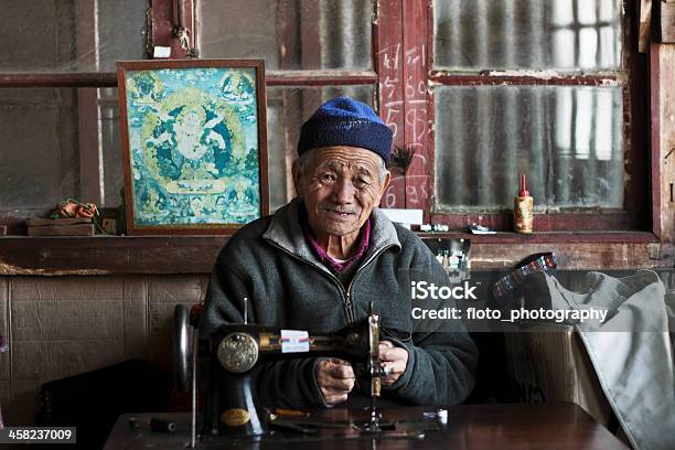 Old Man On A Sewing Machine Stock Photo - Download Image Now - Art And Craft, Buddhism, Built Structure