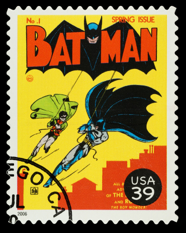 Exeter, United Kingdom - September 19, 2012: A United States used Postage Stamp showing the Comic Book Superheroes Batman and Robin, printed and issued in 2006
