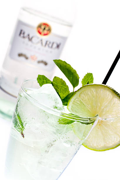 Bacardi Superior Rum Moab, Utah,USA - January 20, 2013: Studio product shot of a bottle of Bacardi superior white rum,, made in Puerto Rico. And a mixed drink. bacardi vodka stock pictures, royalty-free photos & images