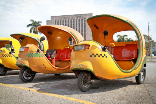 Havana, Cuba - February 2, 2010: Yellow coco taxi on Revolucion plaza on February 2, 2010 in Havana, Cuba