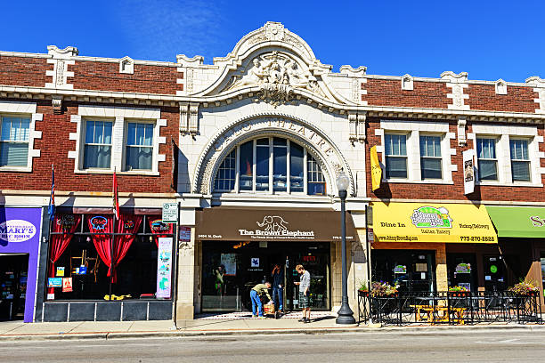 Calo Theatre Building  in Andersonville,  Chicago Chicago, USA - September 14, 2013: Calo Theatre Building on North Clark Street in Andersonville, a neighborhood in the Chicago community  of Edgewater on the Far North Side. Ornate movie palace built in 1915. Now a Now a resale shop, The Brown Elephant.  City street with people outside shop. editorial architecture famous place local landmark stock pictures, royalty-free photos & images