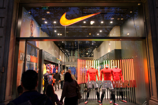 Barcelona, Spain - November 6, 2012: Customers visit Nike store on November 6, 2012 in Barcelona, Spain. Nike is one of most recognized fashion brands. It exists since 1964 and had US$ 19 billion revenue (2010).